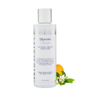 A bottle of hypo-biotic cleanser with flowers.