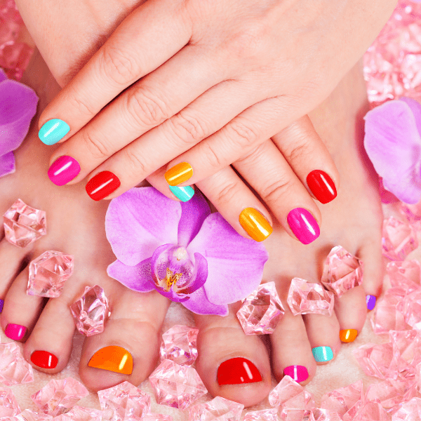 A close up of feet with different colored nails